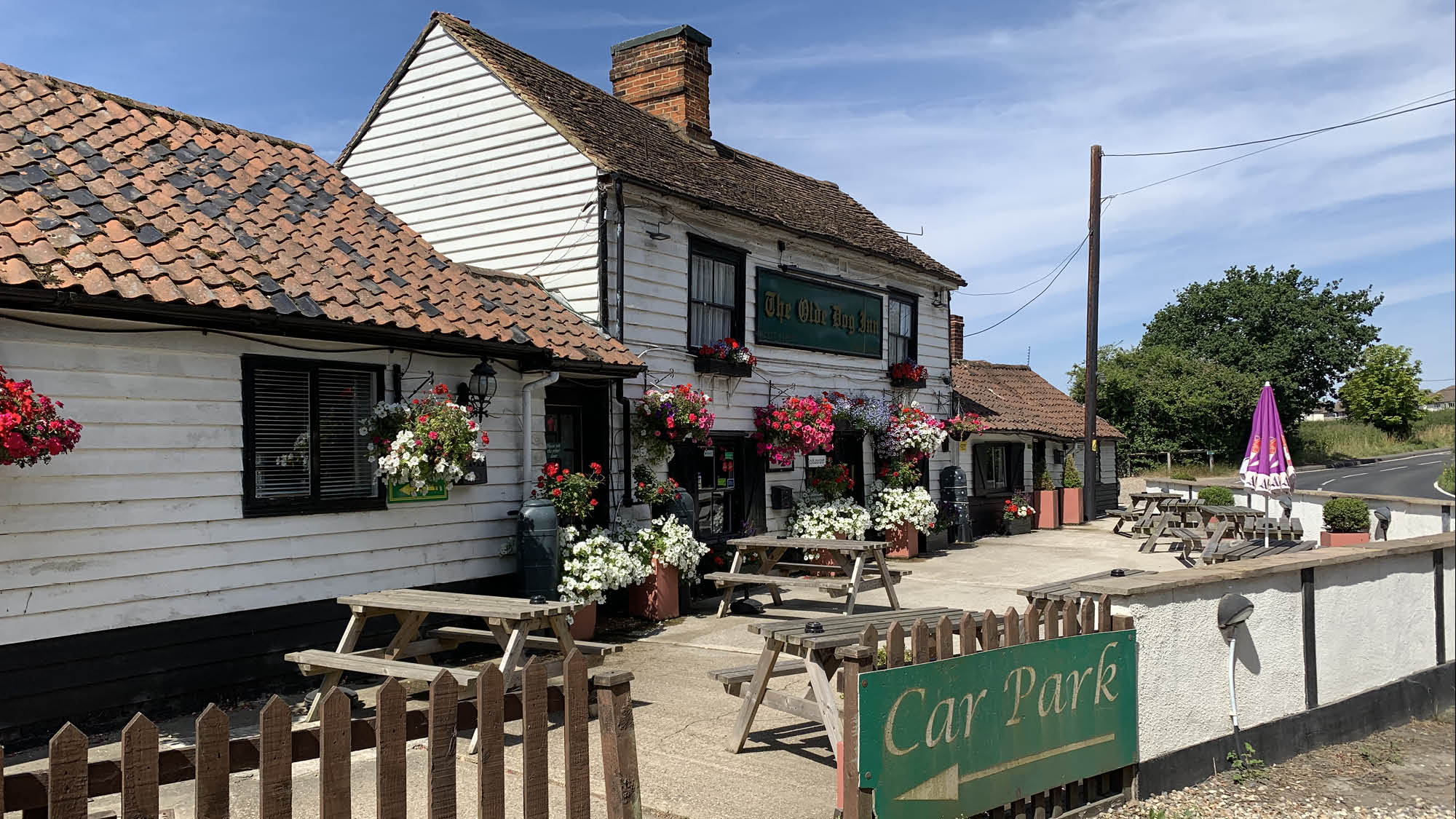 The Old Dog Inn, Herongate: view of pub garden with buildings behind
