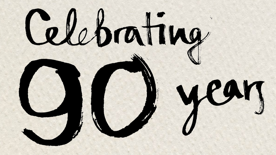 handwritten text: 'celebrating 90 years'