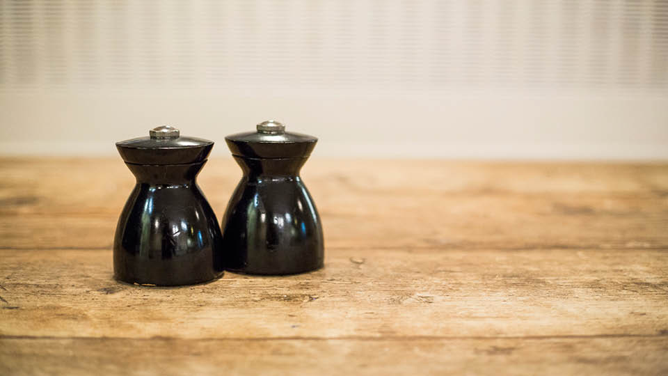 salt and pepper pots on cafe table